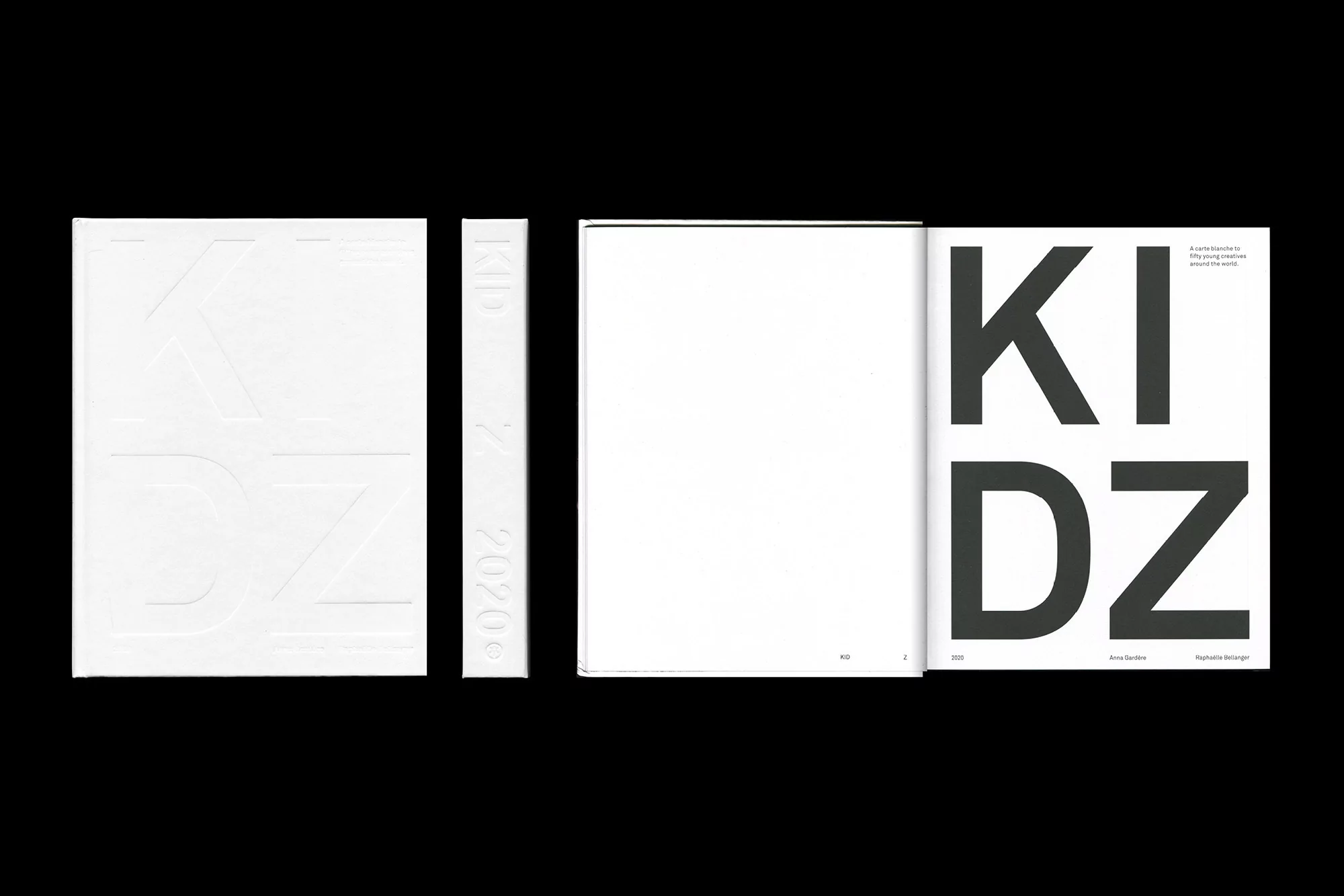 Open Kidz book with embossed cover next to two open white pages and a page with black letters. Typography art, book design.