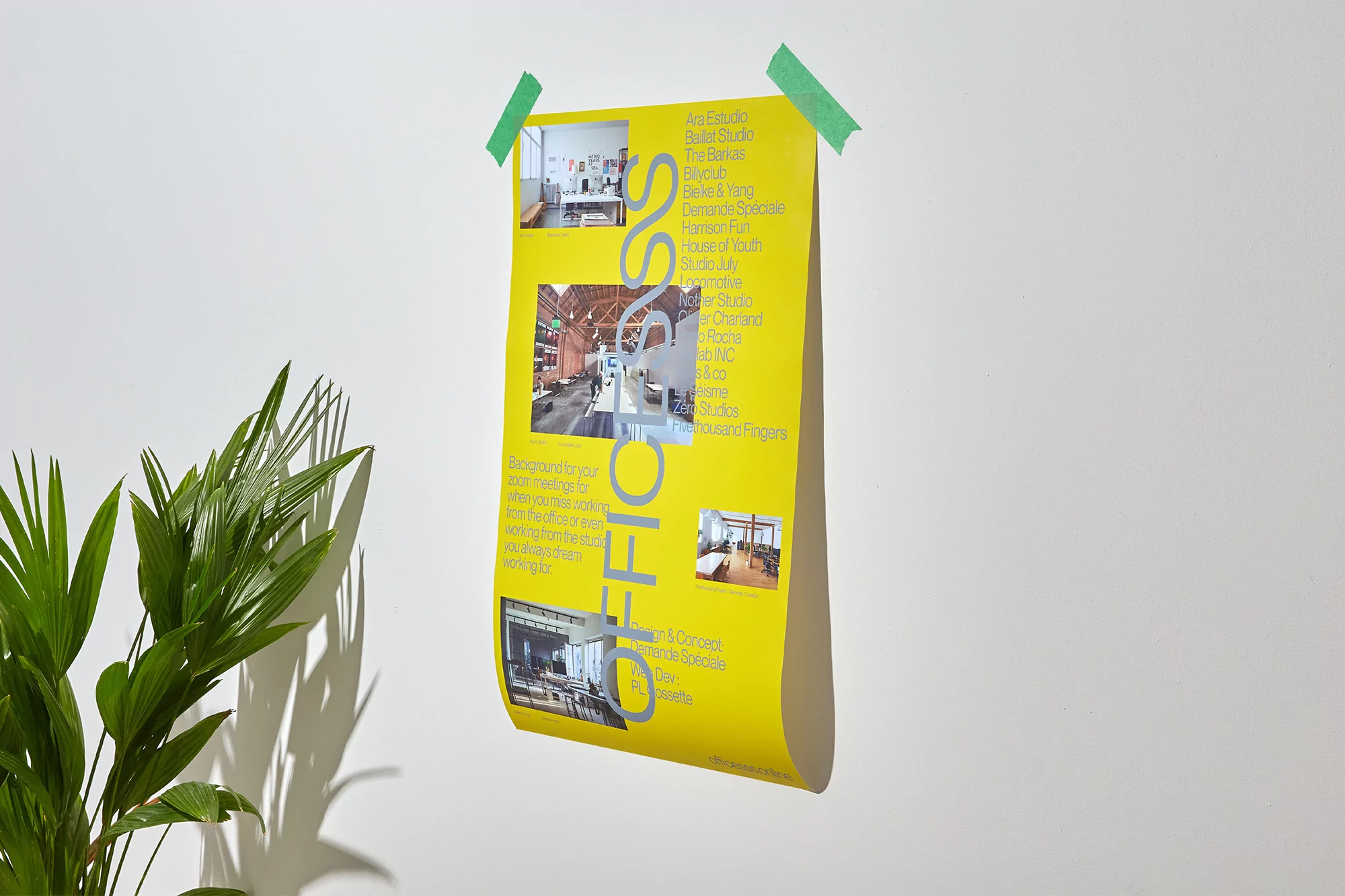 A yellow poster is taped to a white wall next to a green plant, featuring images and text advertising office and studio spaces.