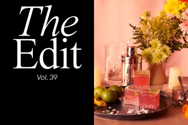 Split-composition image with bold white typography on a black panel beside a still-life bar setup with limes, cocktail shaker, and flowers.