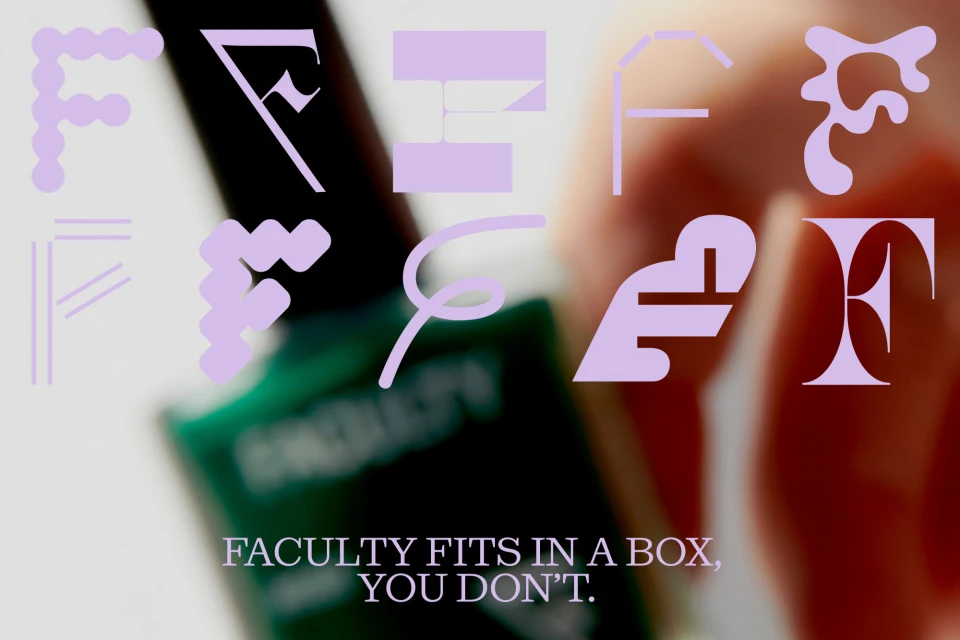 Close-up of a bottle of green nail polish with purple 'F' letter graphics and text that reads 'FACULTY FITS IN A BOX, YOU DON'T.'