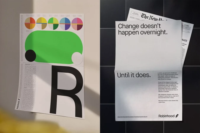 Two Robinhood posters, one with charts and the letter R, the other with the phrase 'Change doesn't happen overnight.'