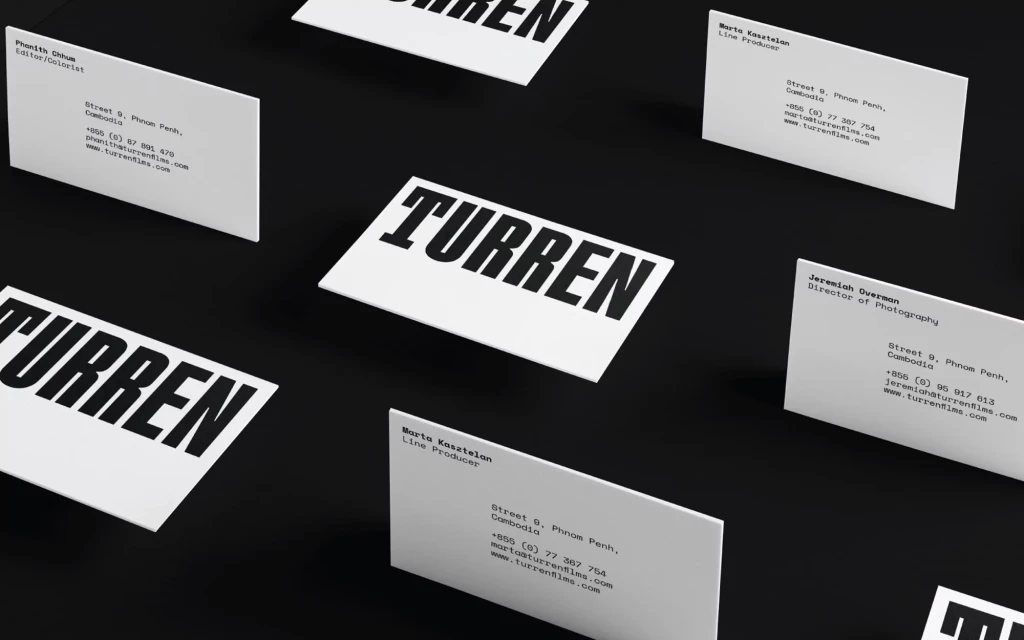 Business cards for Turren films featuring names and contact information arranged on a black background, high contrast, minimalist design.