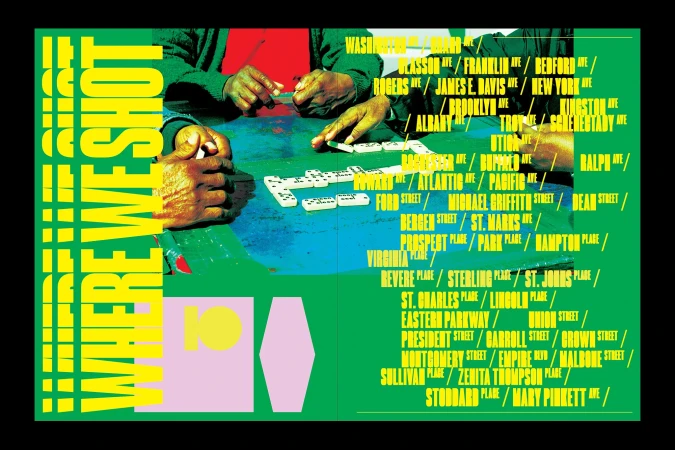 Overhead shot of two people's hands playing dominoes on a green and blue table, surrounded by names of places in Brooklyn, NY.
