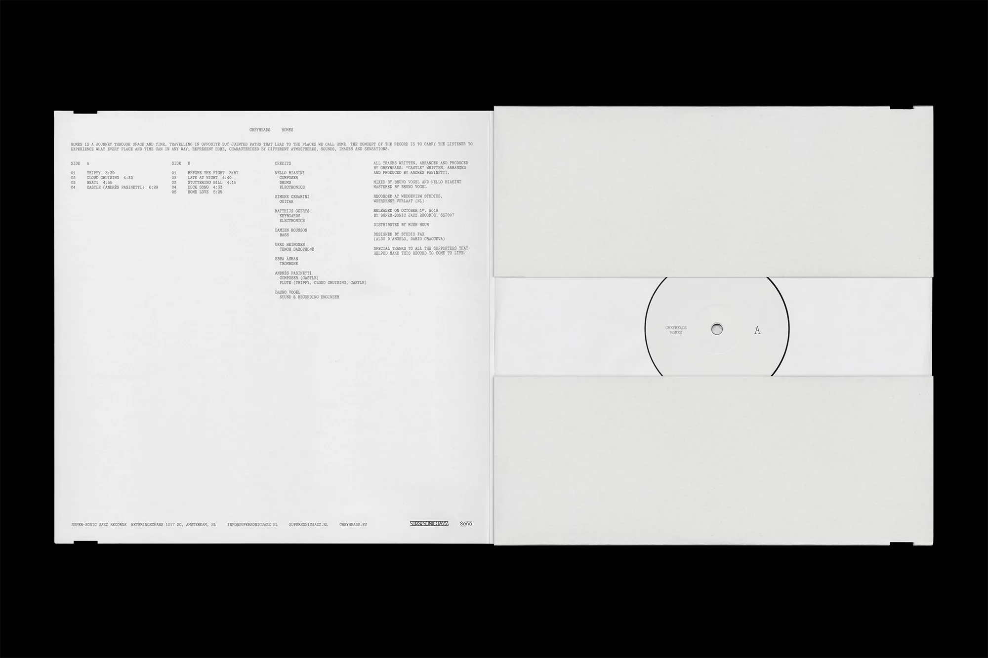 Open white vinyl record packaging featuring album information on the left and the vinyl record on the right, set against black backdrop.