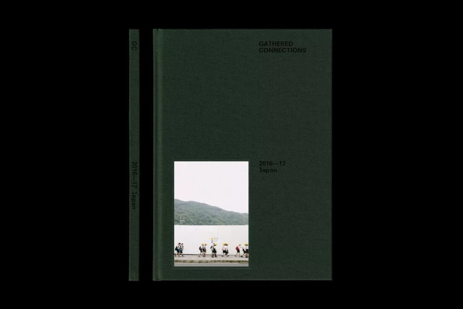 A dark green hardcover book titled 'Gathered Connections' sits next to its spine, revealing a photo of people walking by water.