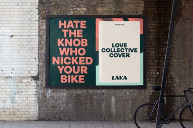 Outdoor advertising billboard on a brick wall featuring bold typographic posters for Laka bike insurance brand identity.