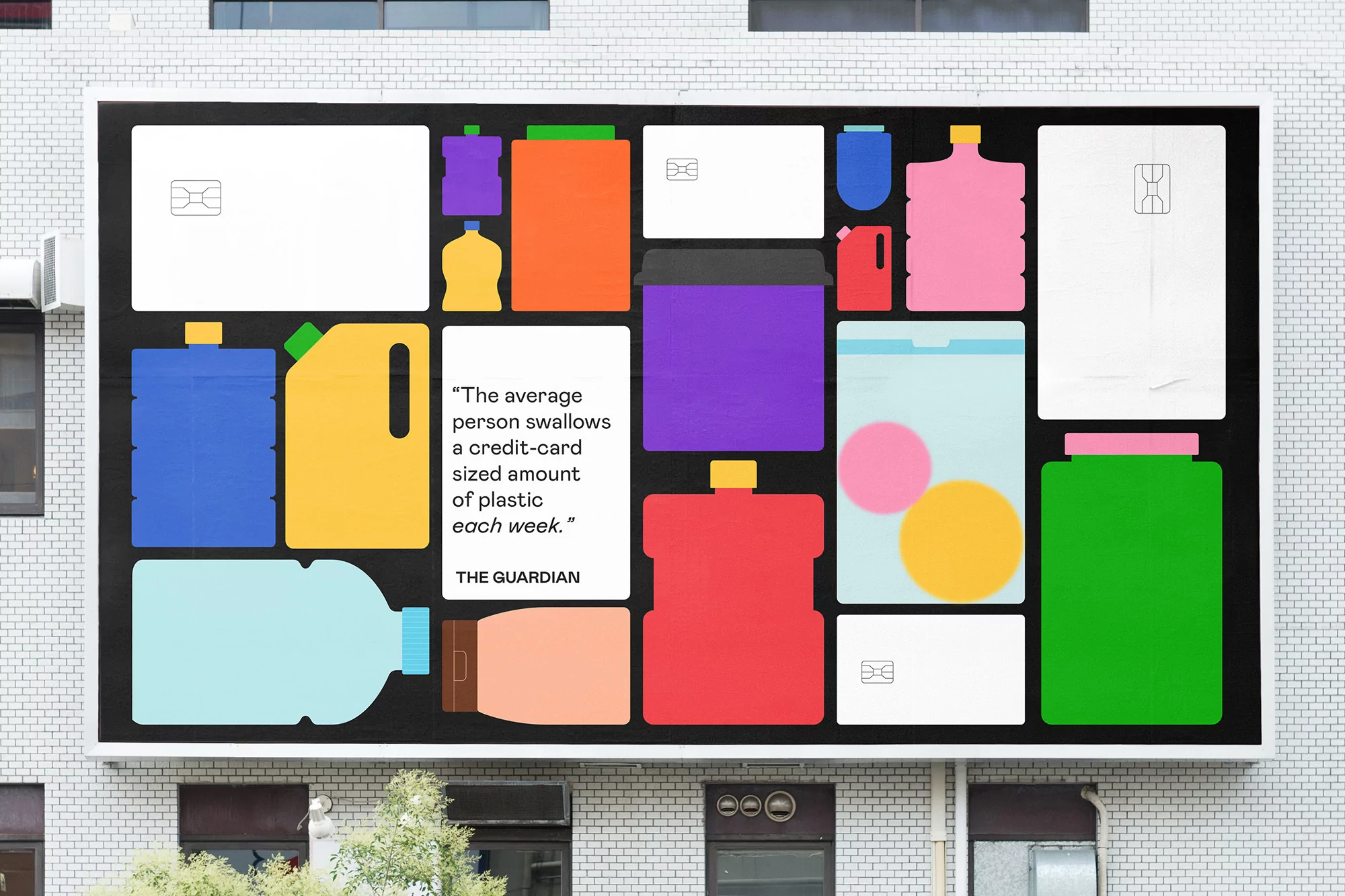 Eye-level shot of an advertising billboard with flat vector graphics of plastic containers and credit cards for a recycling campaign.