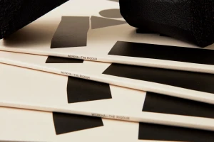 Stacked white records featuring bold black geometric abstract shapes and Werkha text