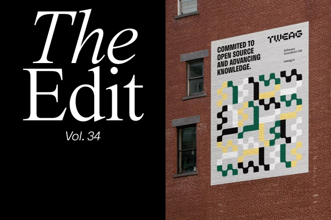 Building exterior with a large geometric mural on the brick wall next to windows; modern typography in the left; architectural image.