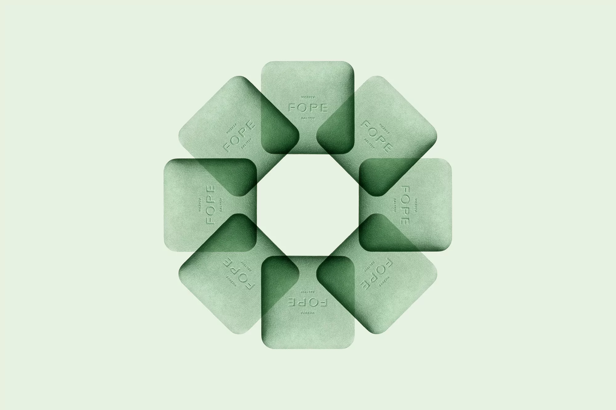 Abstract geometric pattern of green square objects featuring the FOPE jewelry brand logo, arranged in a circular, overlapping design.