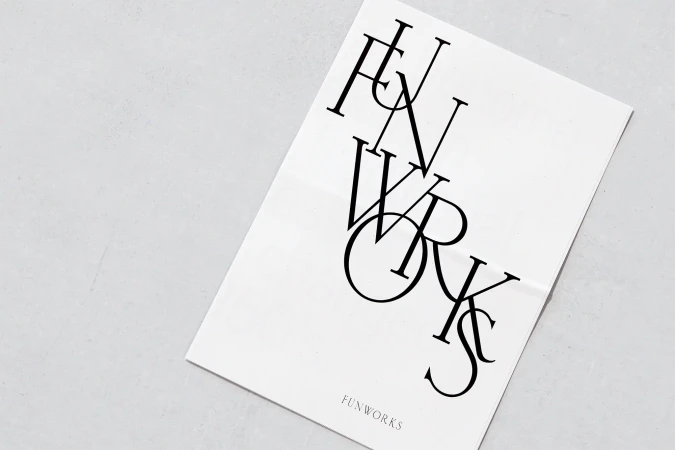 Funworks branding material featuring bold, stylized typography on a minimalist white background, creating a modern and eye-catching design.