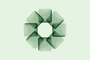 Symmetrical arrangement of eight pale green textured square tiles with embossed text centered on a pale background