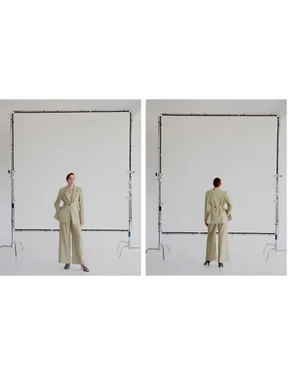 Two studio shots of a woman in a matching beige suit posing in front of a large white photography diffuser frame.