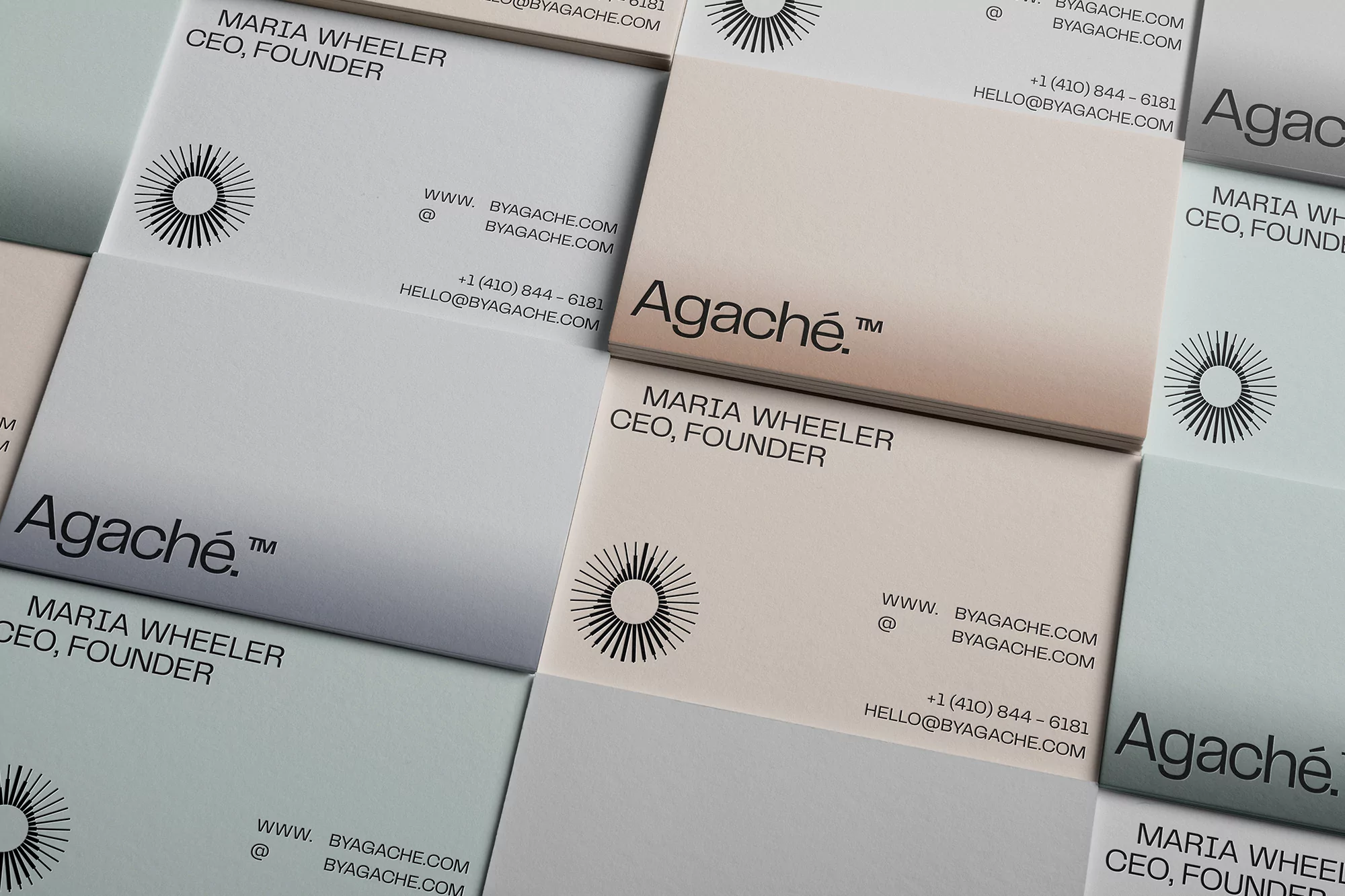 Close-up of business cards with the Agaché logo, company name, and contact information in neutral, muted shades. Square design.