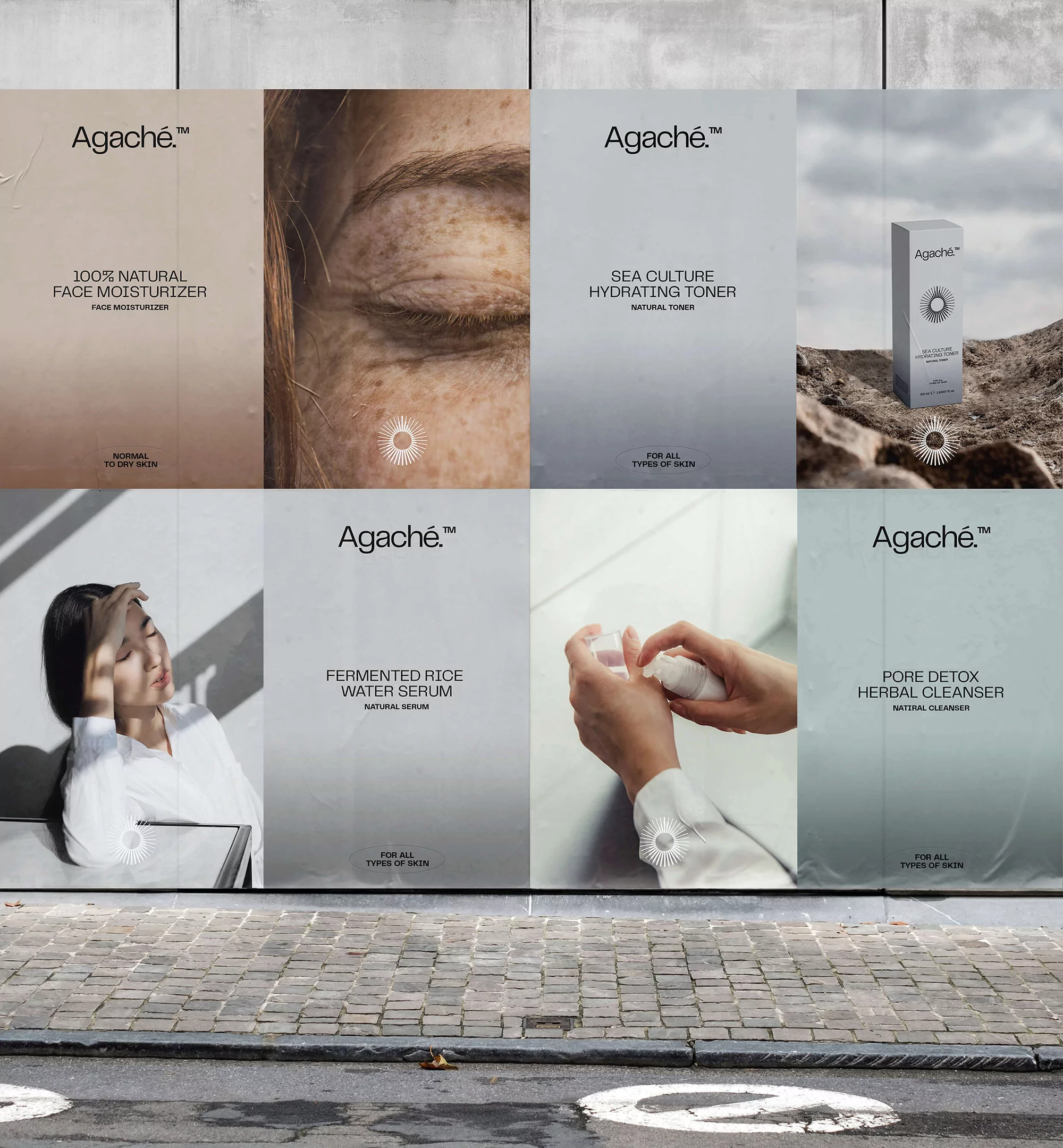 Cosmetic product ads on a wall feature skincare with bottles, hands, and a woman's face, set against a cobblestone urban backdrop.