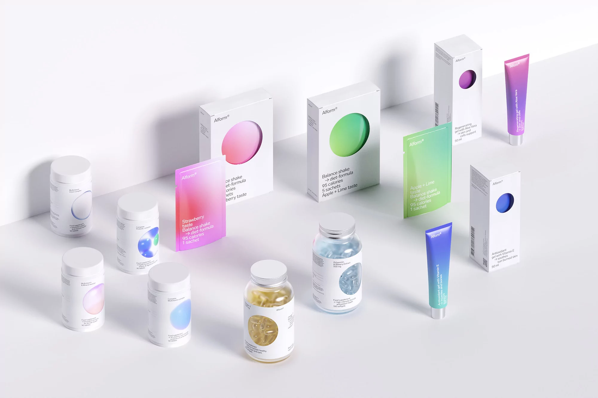 Assorted beauty and wellness product packaging in white, pink, green, and blue hues are arranged on a clean white background.