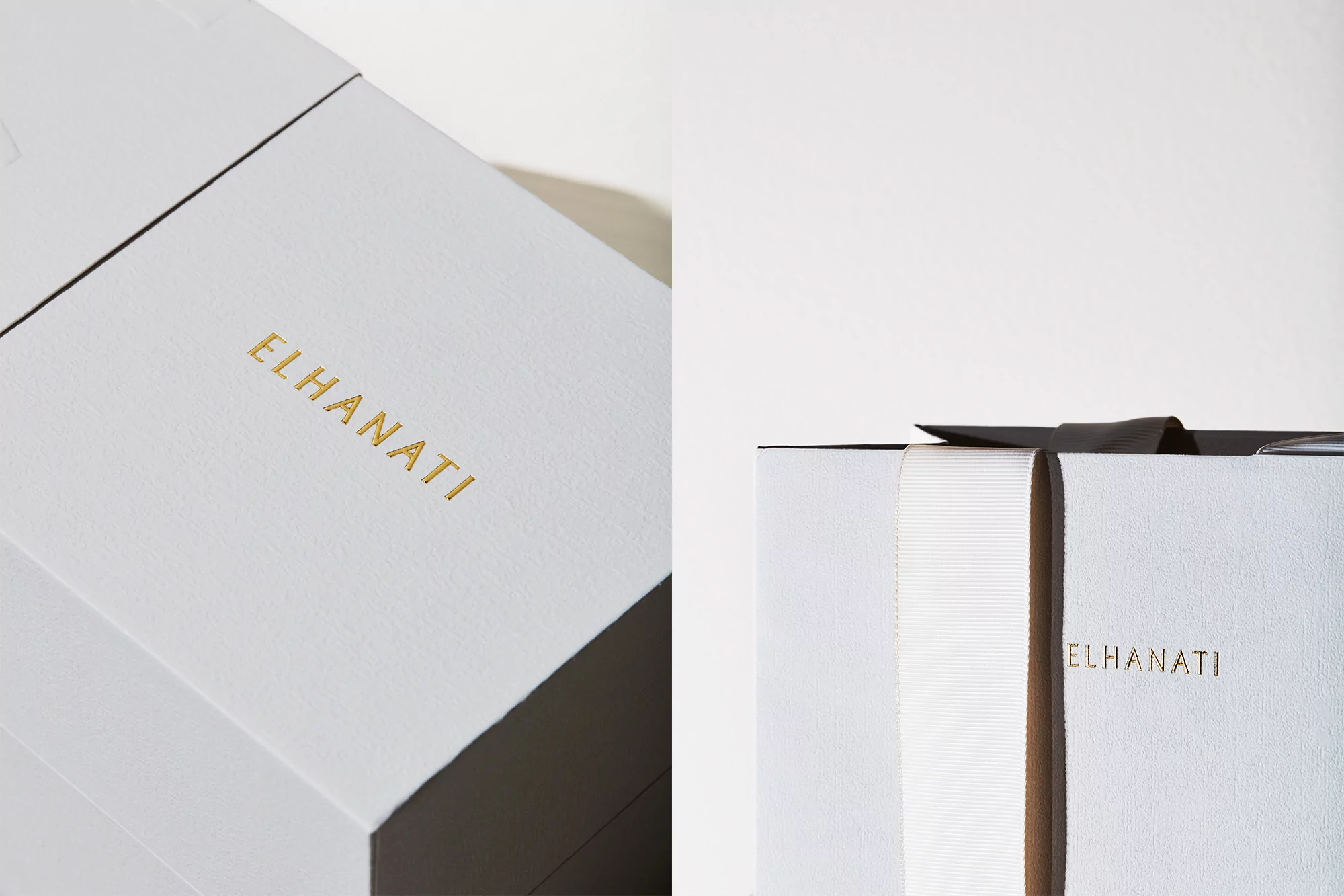 Close-up shot of a white El Hanati gift box with a ribbon, featuring elegant gold lettering and a sleek design on a white background.