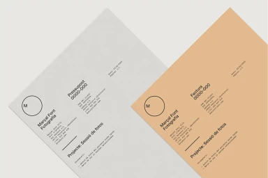 Two angled branded stationery documents with minimalist typography and a circular logo for Marçal Font Fotografia.