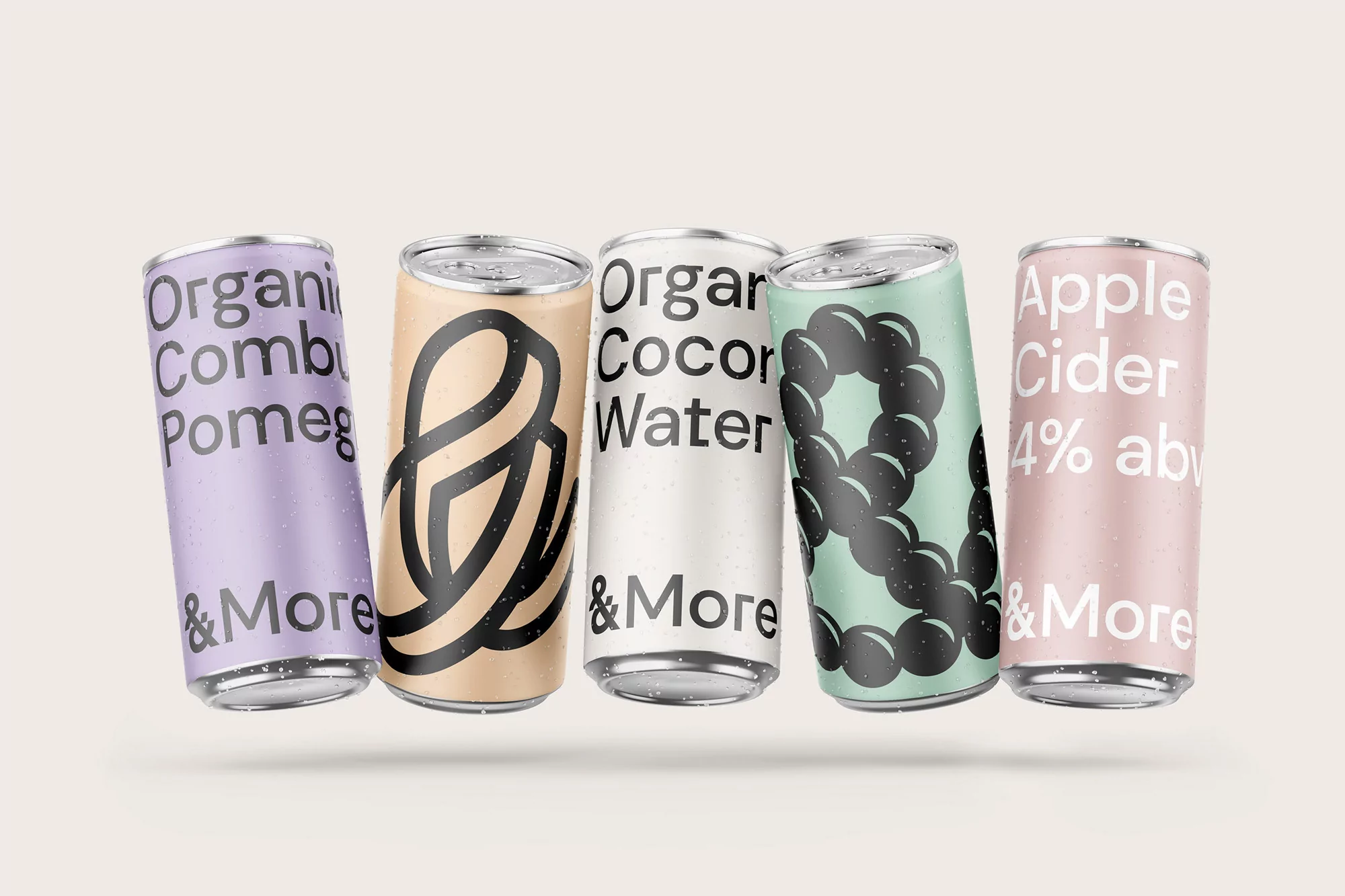 Assortment of colourful aluminum cans featuring various drink names and designs against a neutral background. Beverage container studio shot.