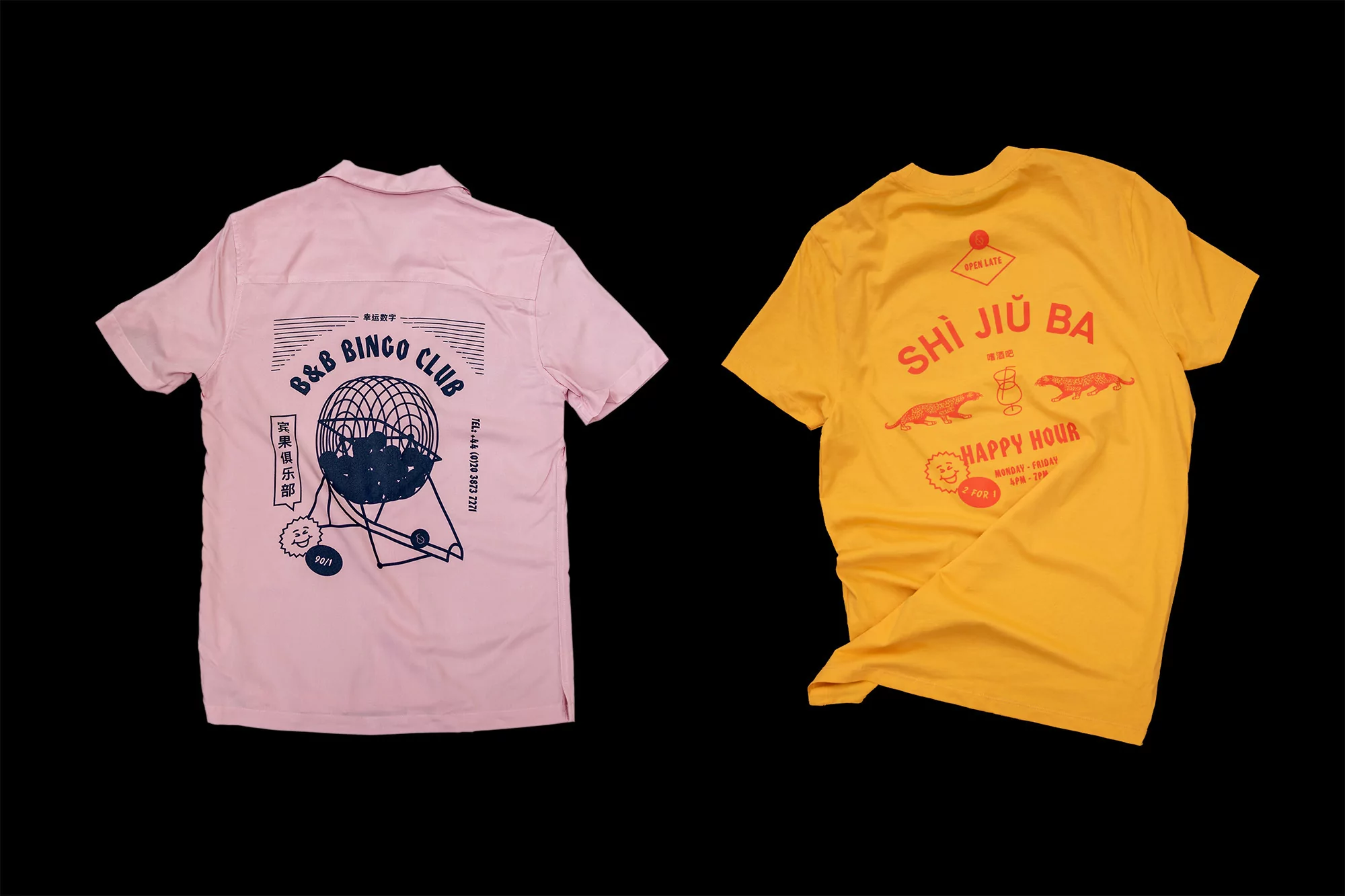 Two t-shirts, one pink short sleeve shirt with a bingo design, and one yellow short sleeve shirt with text and illustration.