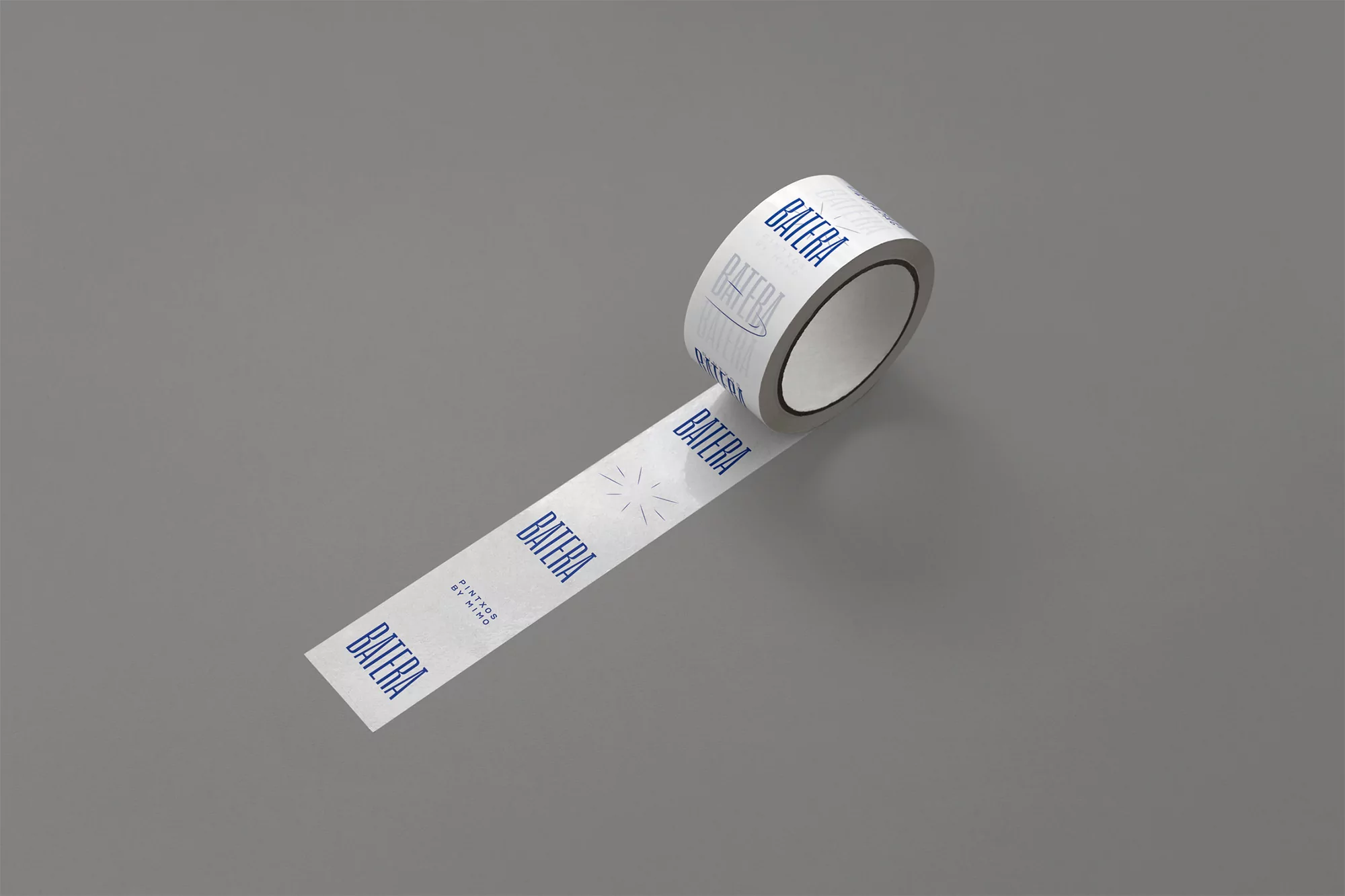 Roll of white custom-branded adhesive tape with repeated 'Batera' logo on a solid gray background for packaging and branding projects.
