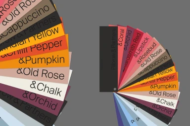 Colour swatch fans displaying various brand shades and typography against a solid grey background