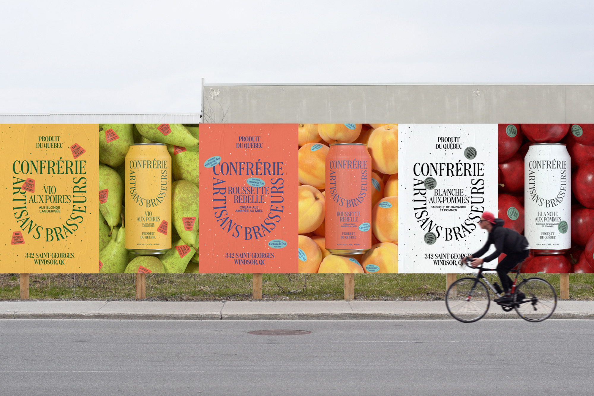 Eye-level shot of Confrérie canned drinks advertising panels outdoors, with a cyclist in motion, highlighting branding, typography, and product appeal.
