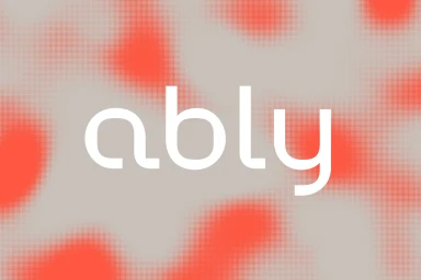 White typographic logo ably centered on a grey background with red halftone pattern blobs