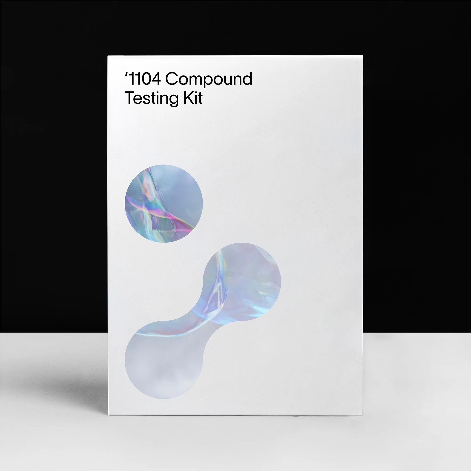 White box product shot features '1104 Compound Testing Kit' with iridescent graphics against a black and white background.