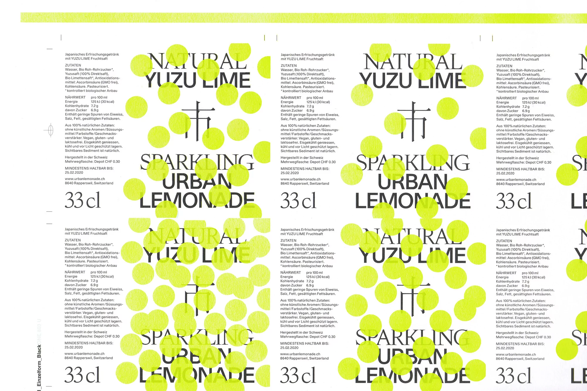 Label featuring the words 'Natural Yuzu Lime Sparkling Urban Lemonade' against a background of yellow dots on a white surface.
