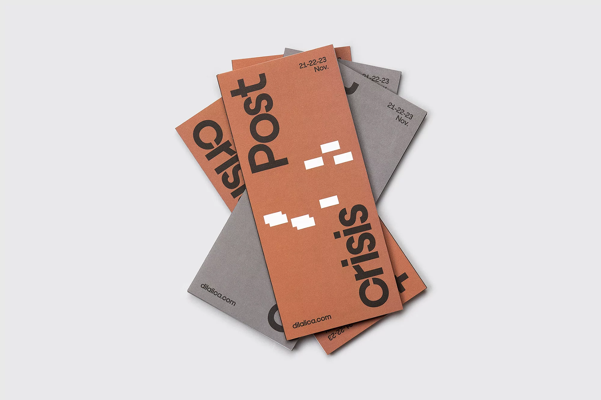 Stack of leaflets featuring 'Post Crisis' text and modern graphic design in muted tones, ideal for marketing or promotional material.