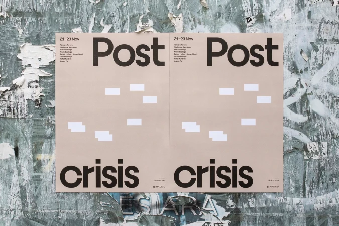 Two identical posters reading 'Post Crisis' are adhered to a textured grey wall with peeling paint, creating an urban, weathered aesthetic.