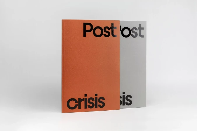 Two hardcover books, one rust orange and one light grey, stand side-by-side against a white background, each with black lettering.