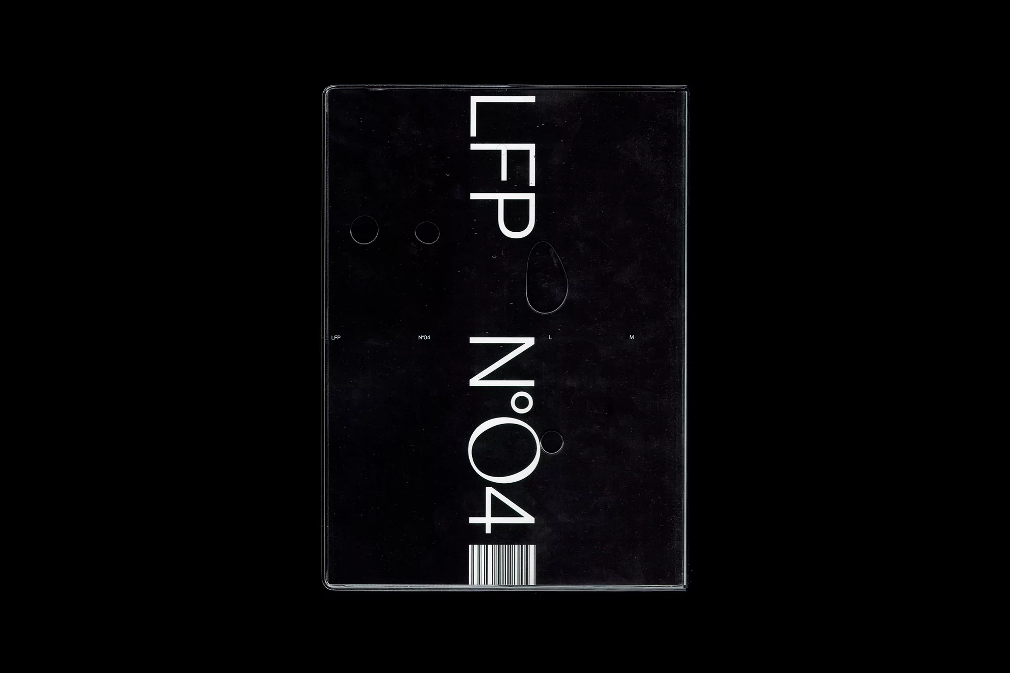 Text art featuring 'LFP N°04' in white on a black surface, highlighting typography and graphic design elements in a minimalist composition.