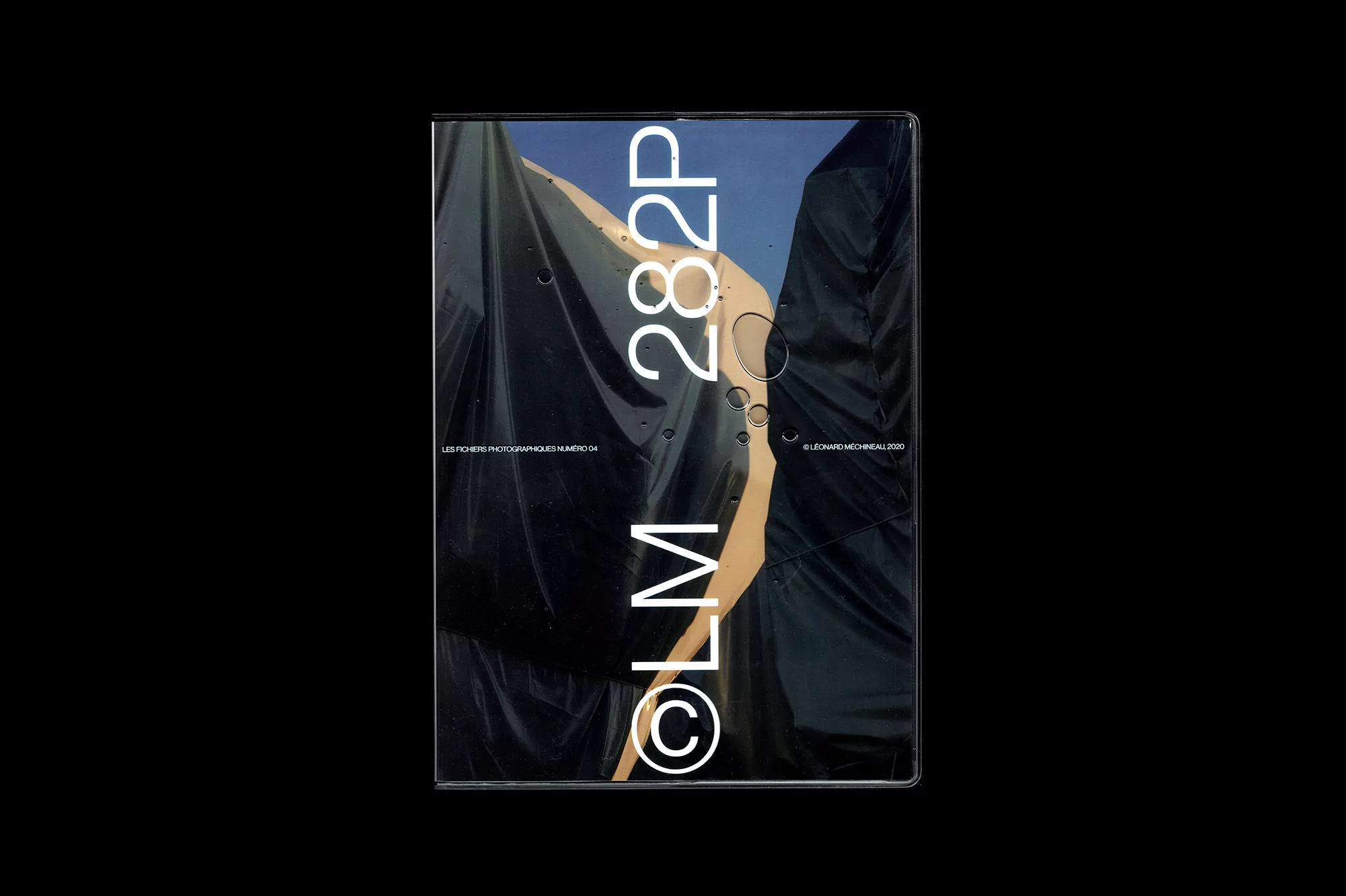 Art book cover with abstract black shapes and sans-serif white text on a black background. Modern design and artistic photography book.