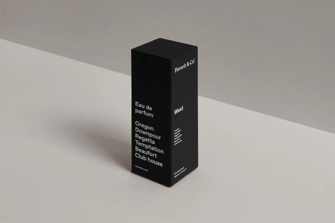 Black box of Favorit & Co Eau de parfum on an off-white surface, angled, with visible text, creating a minimalist and elegant product shot.