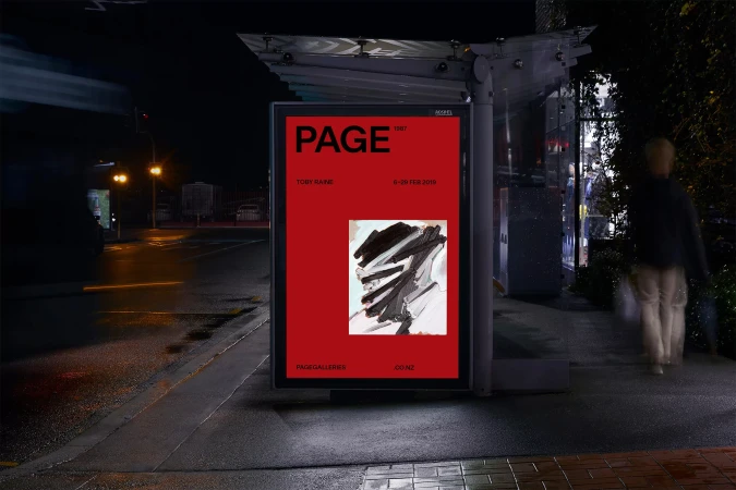 Illuminated bus stop displays an advertisement poster featuring an abstract painting on a red background at night.