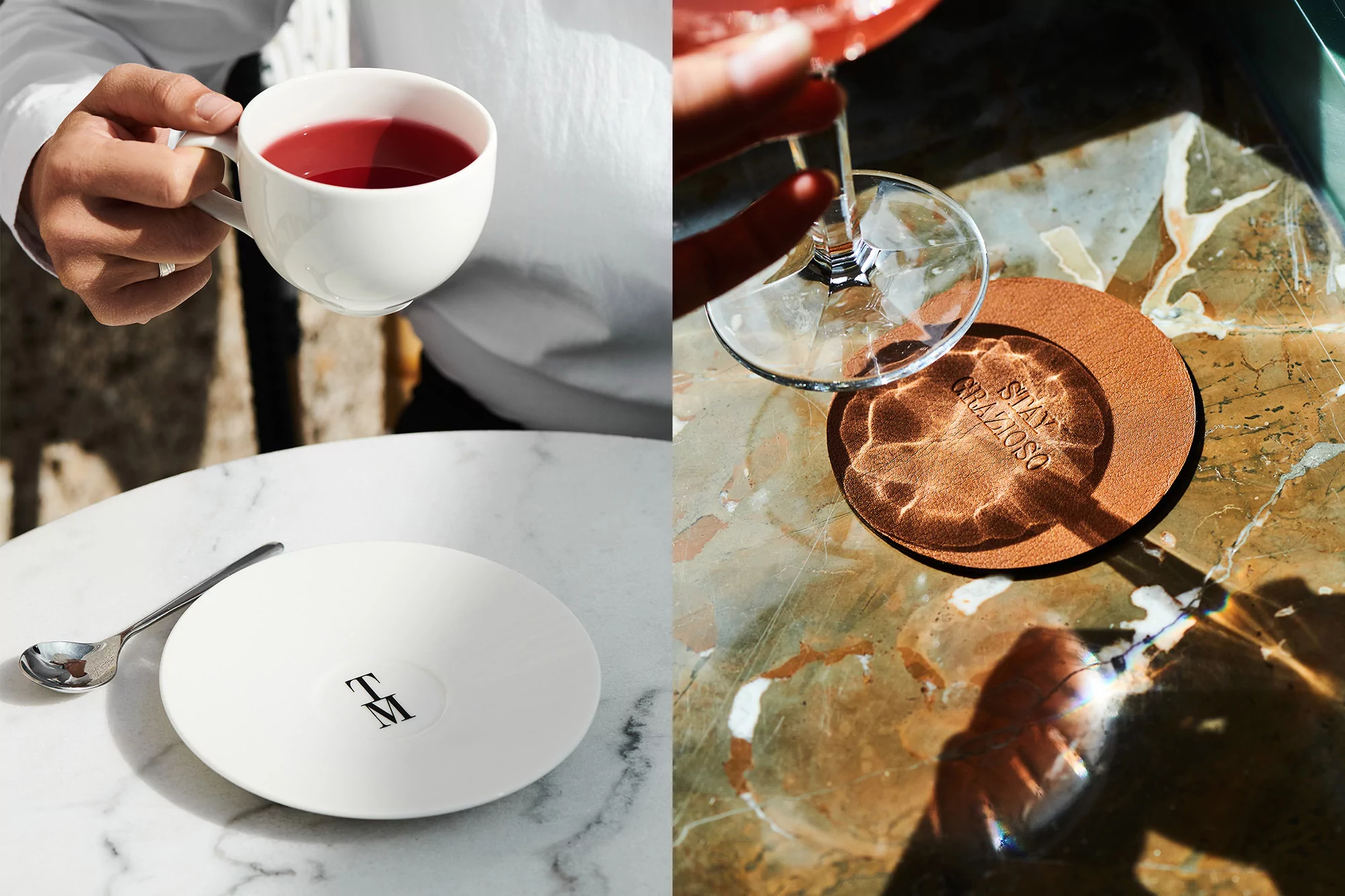 Person in white shirt holds mug with red beverage on white marble table with saucer and spoon; pink cocktail in background.
