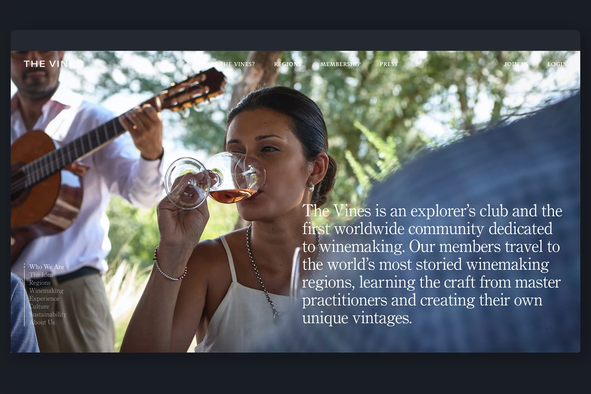 Woman enjoys wine tasting outdoors with guitarist, The Vines website promoting winemaking travel experiences, culture, and sustainability.