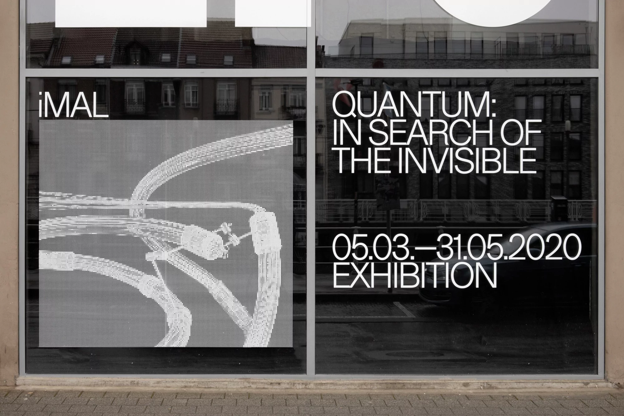 Window display for the 'Quantum: In Search of the Invisible' exhibition, March-May 2020, featuring an abstract digital art graphic.