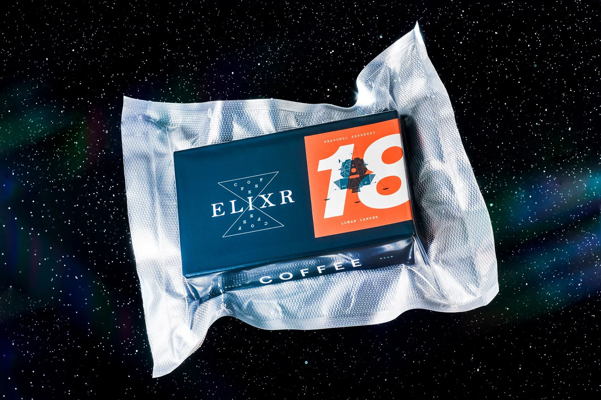 Elixr coffee box in sealed plastic packaging, floating in a black outer space backdrop with starlight and light flare details.