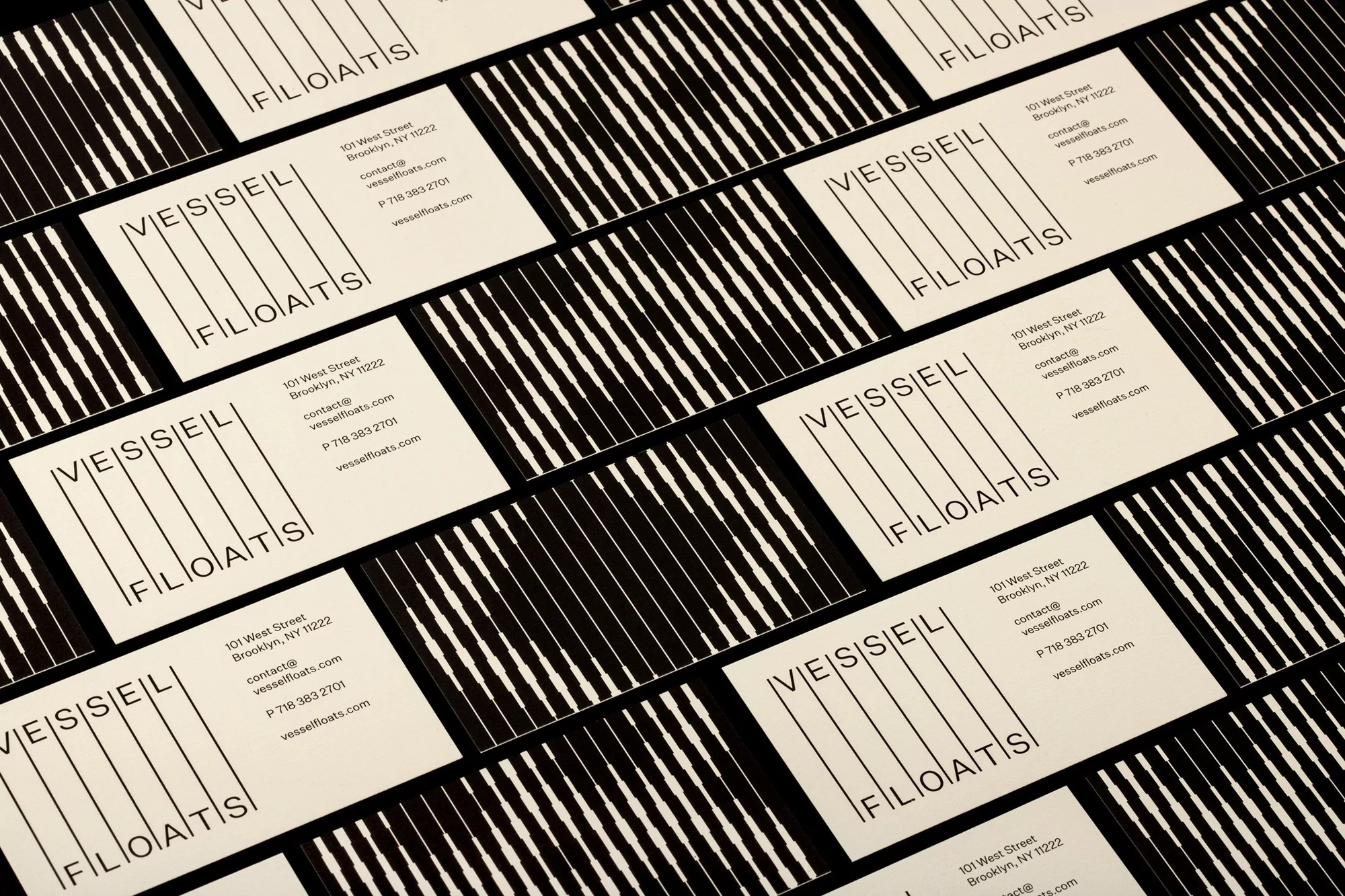 Geometric business card design featuring the company name VESSEL FLOATS in black with a vertically striped pattern in the background.