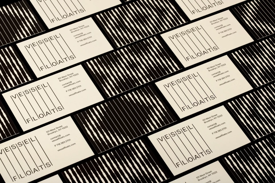 Geometric business card design featuring the company name VESSEL FLOATS in black with a vertically striped pattern in the background.