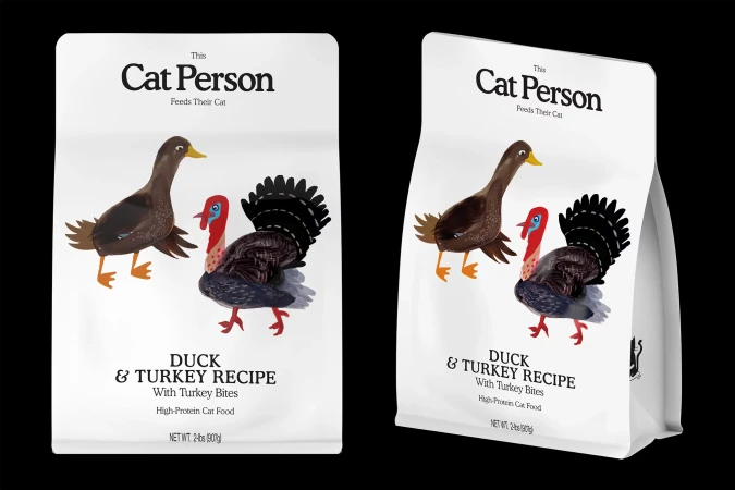 Two bags of cat food featuring illustrations of a duck and a turkey, set against a solid black backdrop for product display.