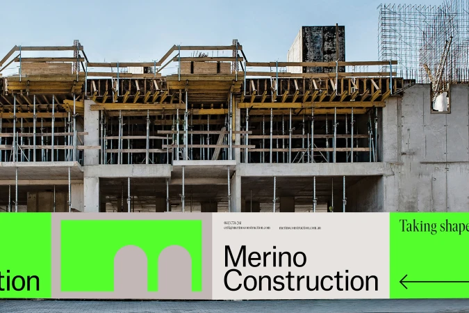 Unfinished concrete building under construction with scaffolding and steel supports against a blue sky with branding at the bottom.