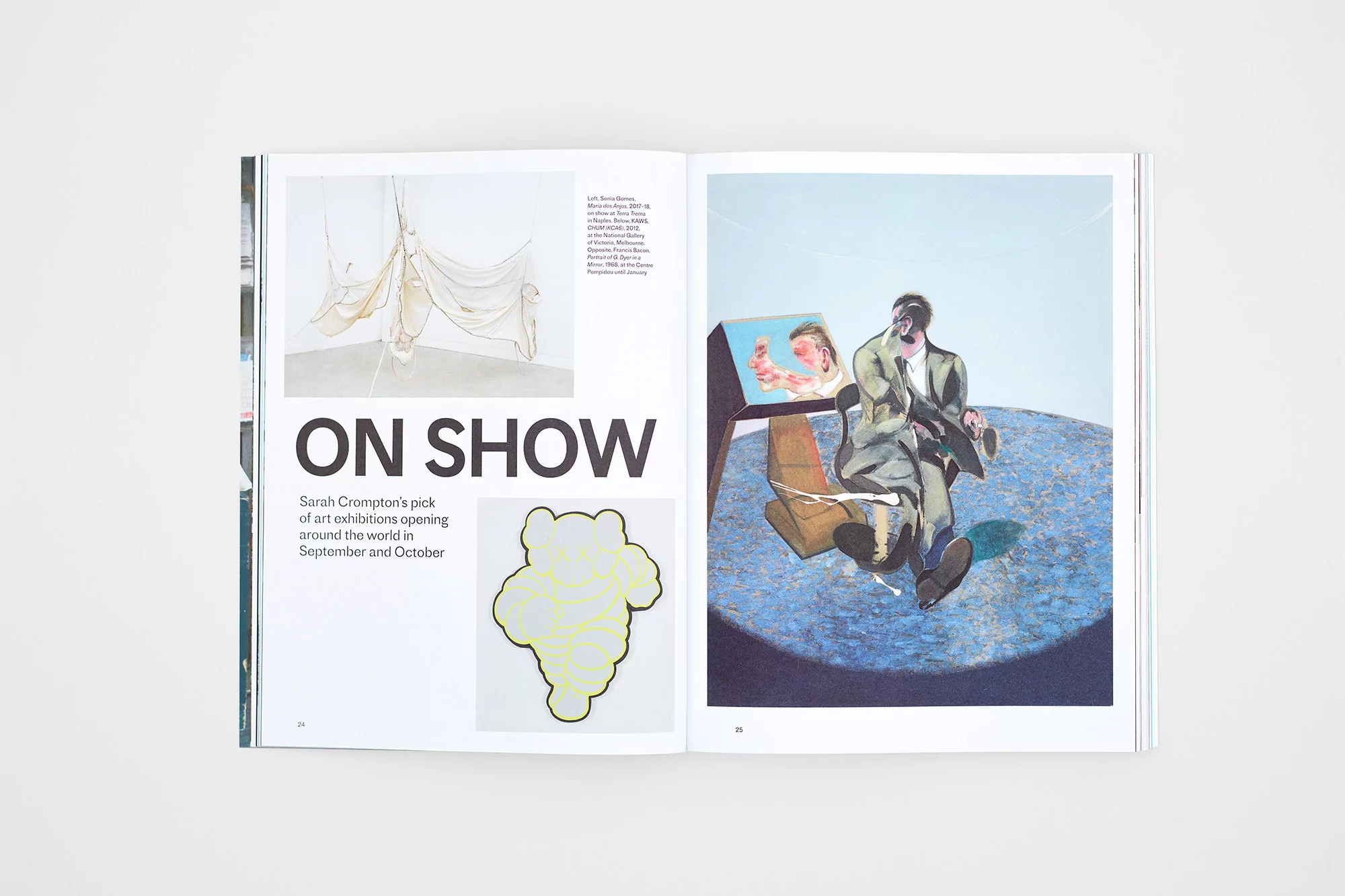 Magazine spread showcases modern art with paintings of human figures in suits and abstract hanging textile art in a gallery setting.