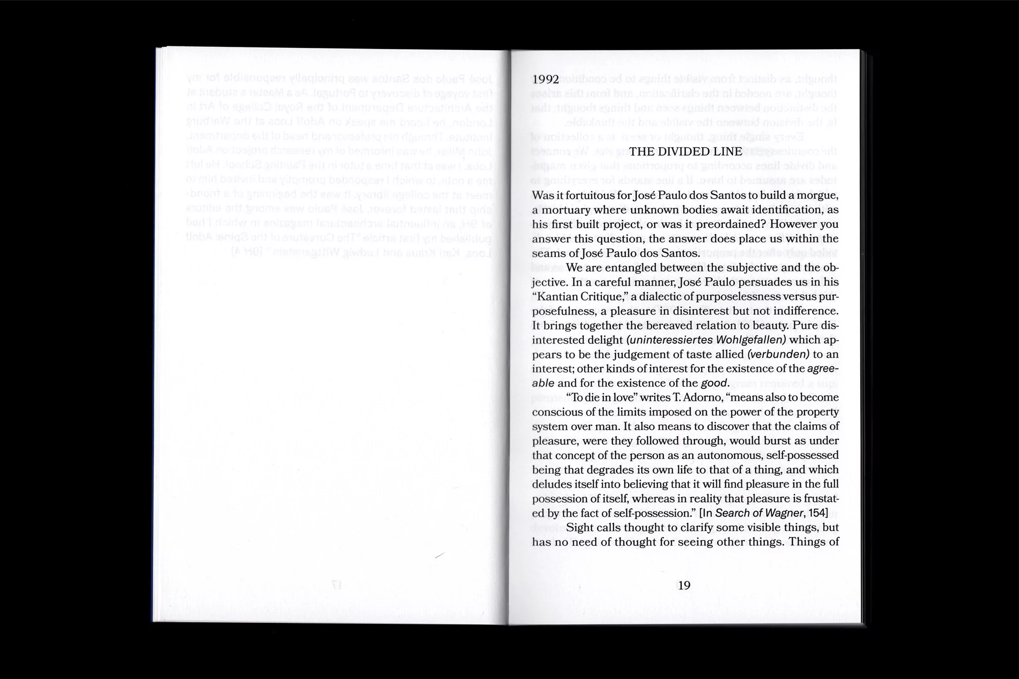 Open book pages displaying dense text in black ink on white paper, with '1992' and 'THE DIVIDED LINE' headings visible.