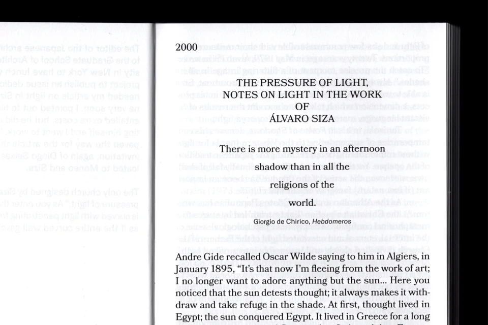 Image of a book's pages, featuring text excerpts from 'The Pressure of Light' by Álvaro Siza, exploring themes of light and shadow.