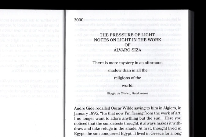 Image of a book's pages, featuring text excerpts from 'The Pressure of Light' by Álvaro Siza, exploring themes of light and shadow.