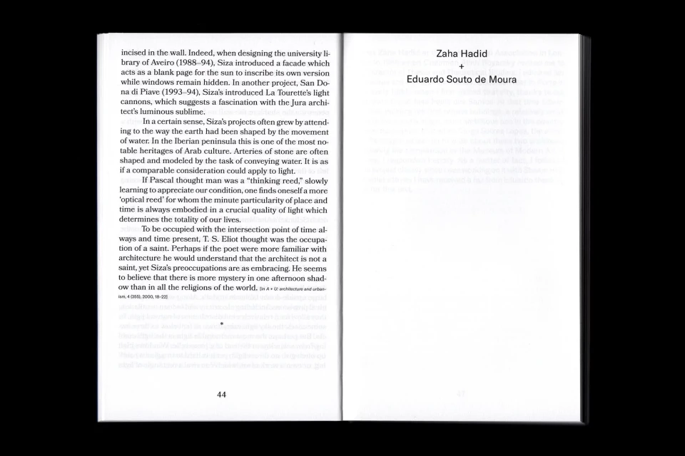 Open book displaying architectural text on white pages, featuring Zaha Hadid and Eduardo Souto de Moura's names. Clear text, dark background.